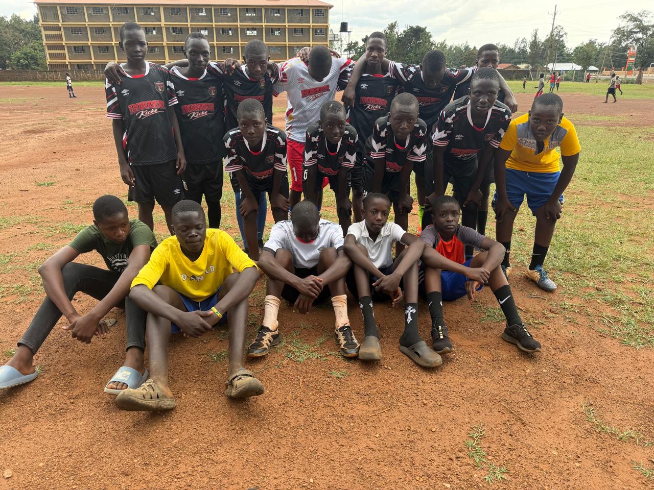 Youth sports team gathered together on a community field